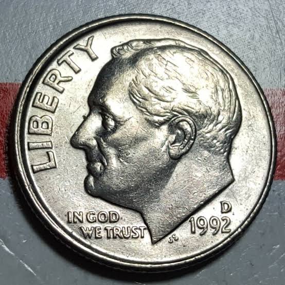 1992 Roosevelt dime off-center strike error showing design dramatically shifted from center with date visible