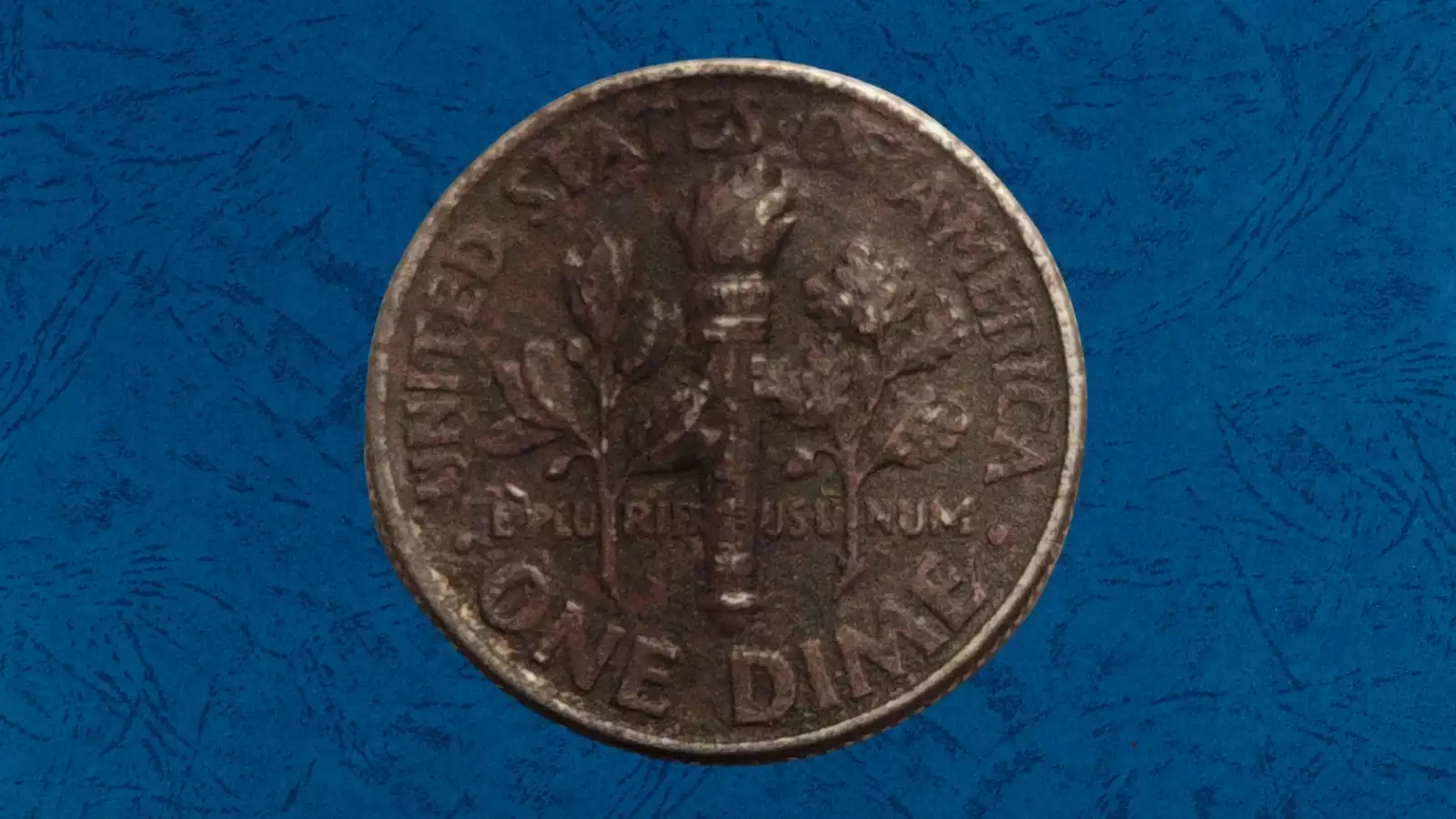 1992 Roosevelt dime missing clad layer error showing copper core exposed on reverse with orange-brown coloration