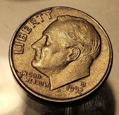 1992 Roosevelt dime struck on wrong cent planchet showing dime design on copper-colored smaller diameter blank